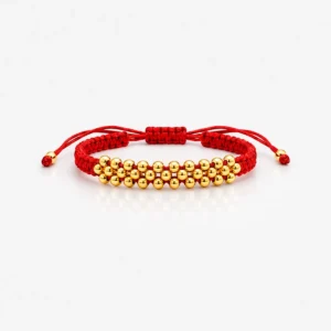 Pulsera tejida roja para mujer con balines dorados brillantes, diseño elegante y ajustable de joyería fina