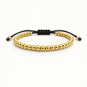 Pulsera Full Balines #4 en oro laminado con diseño ajustable y balines dorados brillantes sobre nailon negro