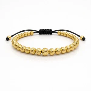 Pulsera Full balín diamantado #6 en oro laminado con balines texturizados y ajuste en nailon negro